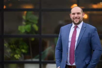 smiling man in a blue suit