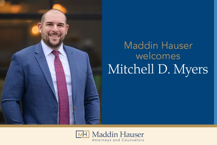 Smiling man in a blue suit